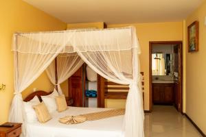 Postel nebo postele na pokoji v ubytování Amazone Hotel Tulear