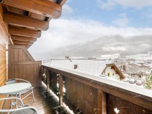 a balcony with a view of the snow covered mountains at Apartment Vorreiter-1 by Interhome in Uttendorf