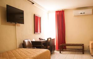 TV a/nebo společenská místnost v ubytování Hotel Estrella