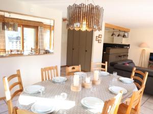 a dining room with a table and chairs at Apartment Dents Rousses B4 by Interhome in Siviez