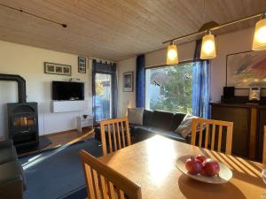 a living room with a table and a couch at Holiday Home Westfalen by Interhome in Dittishausen