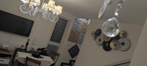 Un televizor și/sau centru de divertisment la Divcibare As apartmani