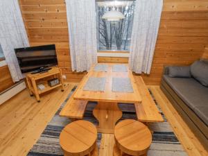 a living room with a coffee table and a couch at Holiday Home Viipusjärvi 10 by Interhome in Ruka