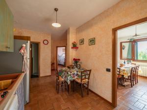 a kitchen and dining room with a table and chairs at Holiday Home Rustico Cavernoso by Interhome in Colle di Val d'Elsa