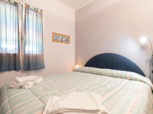 Posteľ alebo postele v izbe v ubytovaní Apartment La Marina by Interhome