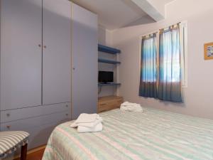 Posteľ alebo postele v izbe v ubytovaní Apartment La Marina by Interhome