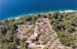 an aerial view of a house on a hill by the water at 2 Bedroom Amazing Home In Vela Luka in Vela Luka