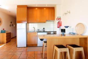 Dapur atau dapur kecil di Vila Alegria Apartment