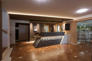 a lobby with a sign that reads fernipedia at Hotel Fernblick in San Valentino alla Muta