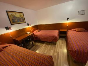 Rúm í herbergi á Saphi Inn Cusco - Excelente ubicación