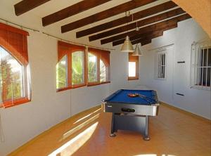 a room with a pool table in the middle of it at La Morada in Altea