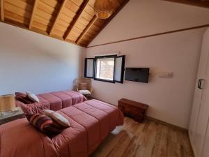 Postel nebo postele na pokoji v ubytování villa los vaqueros