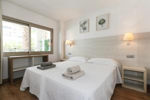 Posteľ alebo postele v izbe v ubytovaní UHC Michelangelo Apartments
