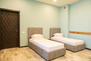 Letto o letti in una camera di B H Y Guesthouse in Yerevan