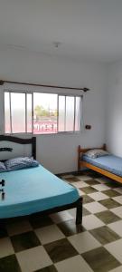 Ένα ή περισσότερα κρεβάτια σε δωμάτιο στο Apartamento na praia