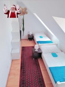 a room with two beds and a red carpet at Favoriten-Rooms in Vienna