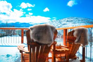 two chairs with faux fur on them sitting on a porch at Ultra Luxury Chalet near Cappadocia - up to 9 people in Kayseri