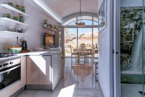 a kitchen with a view of a dining room at 1001 Ocean view house - Puerto Rico in Mogán