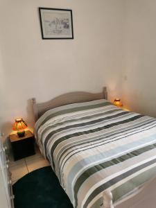 Posteľ alebo postele v izbe v ubytovaní Le Cosy d'Eden