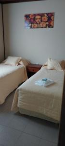 Cama ou camas em um quarto em Cabañas Oyikil