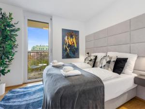 Posteľ alebo postele v izbe v ubytovaní SKY9 Penthouse Apartments