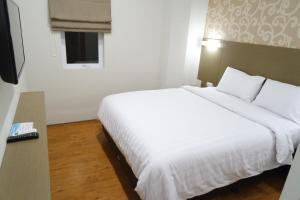 Postel nebo postele na pokoji v ubytování Yokotel Hotel
