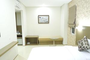 Postel nebo postele na pokoji v ubytování Yokotel Hotel