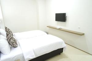 Postel nebo postele na pokoji v ubytování Yokotel Hotel