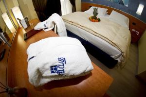 Uma cama ou camas num quarto em Best Western Hotel Class Lamezia