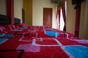 Cama o camas de una habitación en Hotel Élite Internacional