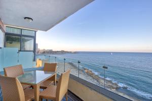 a view of the ocean from the balcony of a house at Spacious Seafront 3BR, Sliema near Beach, AC Wifi by 360 Estates in Sliema