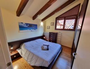 A bed or beds in a room at Saluzzo Historic Center Apartment