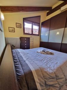 A bed or beds in a room at Saluzzo Historic Center Apartment