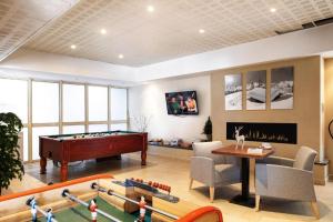 a living room with a pool table and ping pong ball at Les TERRASSES D'ISOLA 2000 in Isola