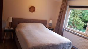 Postel nebo postele na pokoji v ubytování Stadtnahe Wohnung mit Garten und Parkplatz