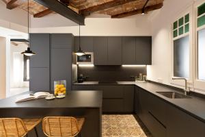 Kuchyň nebo kuchyňský kout v ubytování Enjoy Apartments La Riera One