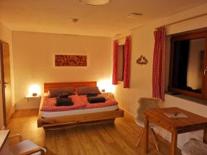 a bedroom with a bed with two pillows on it at Chalet Winterberg in Winterberg