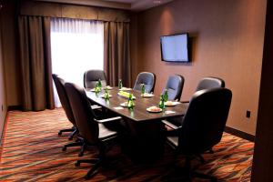 a conference room with a long table and chairs at Holiday Inn Express Pembroke, an IHG Hotel in Pembroke