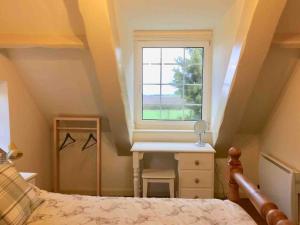 a bedroom with a bed and a window at Grove Farm Loft Annexe Includes Continental Breakfast in Lincoln