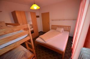 a small room with two bunk beds and a mirror at Appartment Stepanek in Saalbach-Hinterglemm