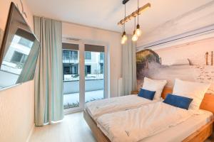 Łóżko lub łóżka w pokoju w obiekcie Klif Apartamenty Nadmorskie Tarasy