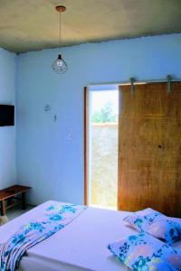 Postel nebo postele na pokoji v ubytování Mar de Arraial, Suites da Ju