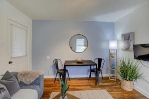 a living room with a table and chairs at Midtown Cottage Walk to Overton Square in Memphis +28 photos