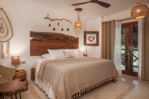 A bed or beds in a room at El Corazón Boutique Hotel - Adults Only with Beach Club's pass included