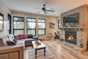 a living room with a couch and a fireplace at Rental condo Tremblant-les-Eaux in Mont-Tremblant