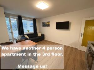 Televízia a/alebo spoločenská miestnosť v ubytovaní Gemütliches 4er Apartment in Skilift-Nähe