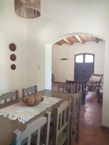a dining room with a table and some chairs at Casona Inkill Huasi II in Tilcara