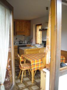 a kitchen with a table with a table cloth on it at Casa Erica - Carano in Carano