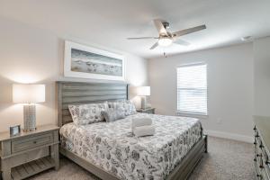 a bedroom with a bed and a ceiling fan at Serenity Island Treasure At 7868 Evening Glow Drive in Pensacola