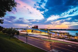 a view of a bridge over a street at sunset at Gated Cottage Community! Ideal Midtown Spot in Memphis